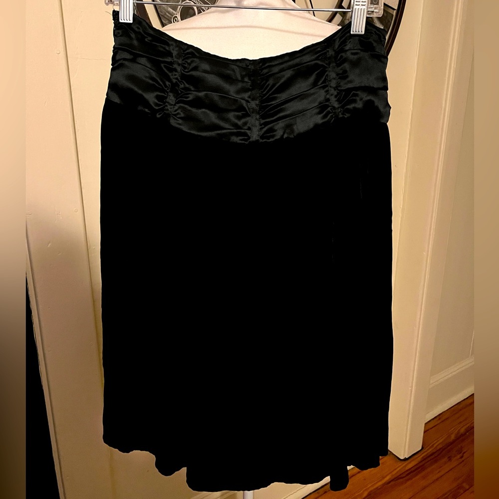 Black Fresh twist velvety skirt with satiny waist. Size 8. Excellent condition.